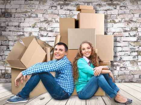 Professional movers packing items into a truck