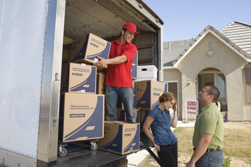 People packing items for moving in Chelsea